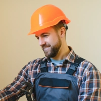 plumber man is blocking repairs radiators of